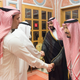 King Salman shaking Salah’s hand, Mohammad bin Salman is pictures in the back.